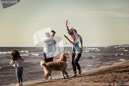 Image of happy young family enjoying vecation during autumn day