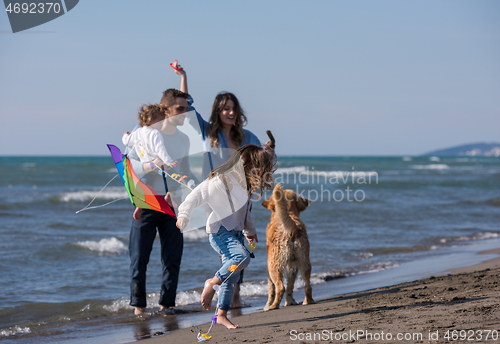 Image of happy young family enjoying vecation during autumn day