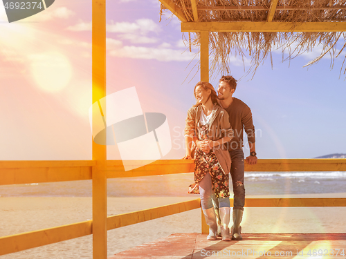 Image of Couple chating and having fun at beach bar