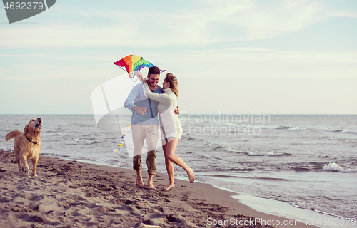 Image of happy couple enjoying time together at beach