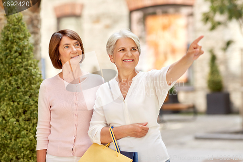 Image of senior women with shopping bags in tallinn city