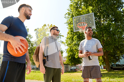 Image of group of male friends going to play basketball