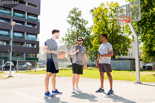 Image of group of male friends going to play basketball