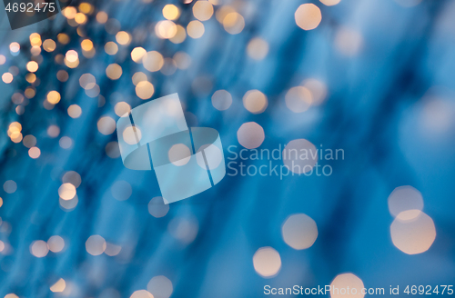 Image of christmas garland lights over dark blue background