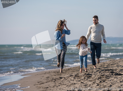 Image of Young family enjoying vecation during autumn