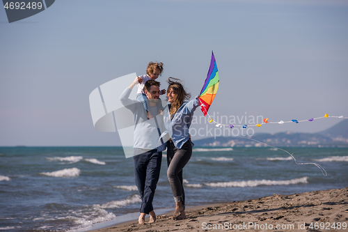 Image of happy family enjoying vecation during autumn day