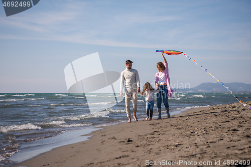 Image of happy family enjoying vecation during autumn day