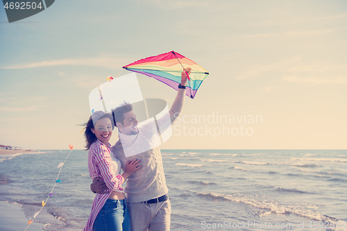 Image of Couple enjoying time together at beach