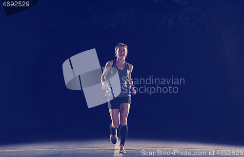 Image of female runner training for marathon