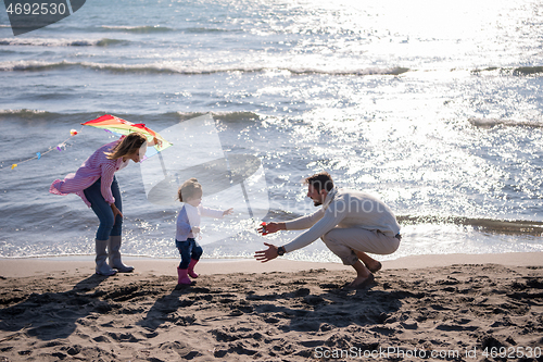 Image of happy family enjoying vecation during autumn day