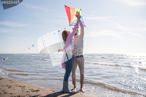 Image of Couple enjoying time together at beach