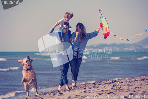 Image of happy young family enjoying vecation during autumn day