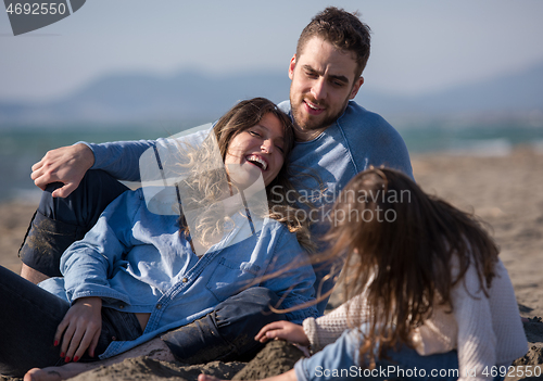 Image of Young family enjoying vecation during autumn