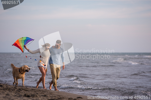 Image of happy couple enjoying time together at beach