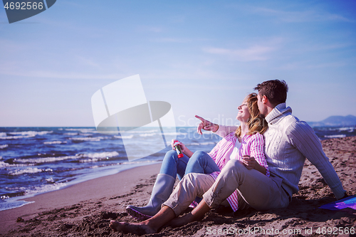 Image of young couple enjoying time together at beach