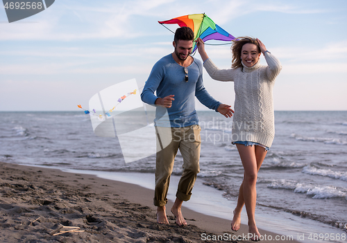 Image of Couple enjoying time together at beach