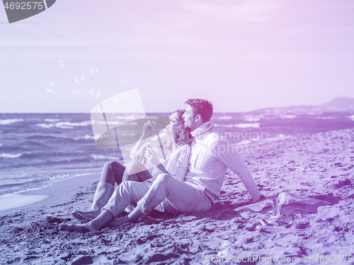 Image of young couple enjoying time together at beach