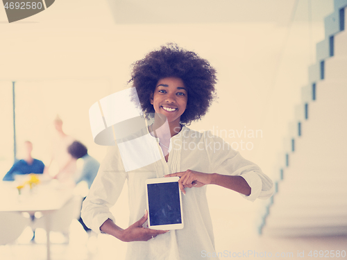 Image of Portrait of  black casual businesswoman using tablet  with cowor