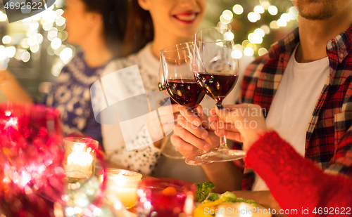 Image of close up of friends with wine celebrate christmas