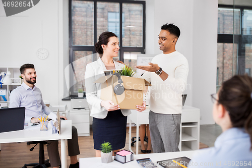 Image of new female employee with colleagues at office