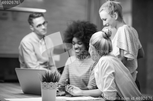 Image of Multiethnic startup business team in night office