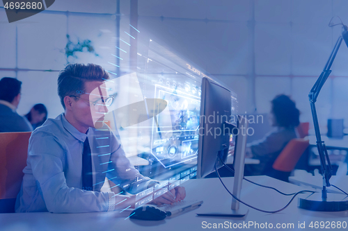 Image of businessman working using a computer in startup office