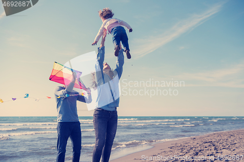 Image of happy family enjoying vecation during autumn day