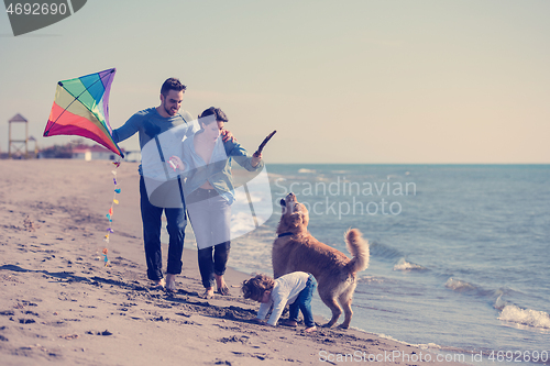 Image of happy young family enjoying vecation during autumn day