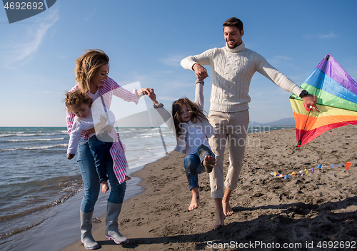 Image of happy family enjoying vecation during autumn day