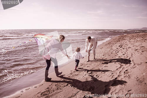 Image of happy family enjoying vecation during autumn day