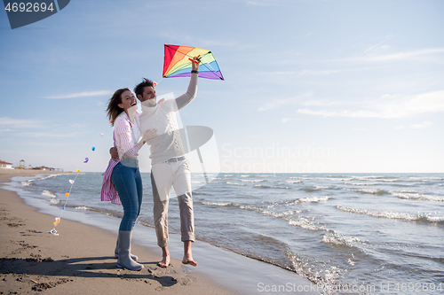 Image of Couple enjoying time together at beach