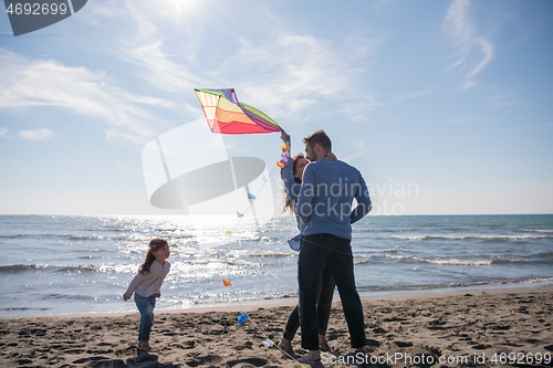 Image of happy family enjoying vecation during autumn day