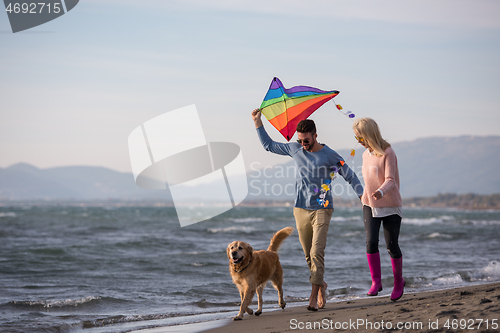 Image of happy couple enjoying time together at beach