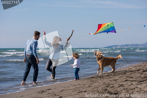 Image of happy young family enjoying vecation during autumn day