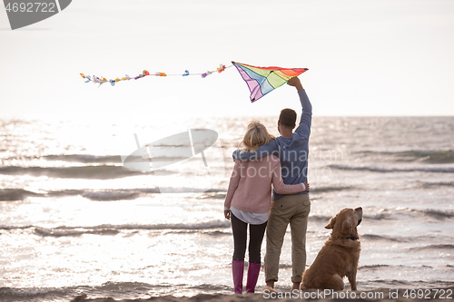 Image of happy couple enjoying time together at beach