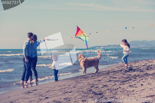 Image of happy young family enjoying vecation during autumn day