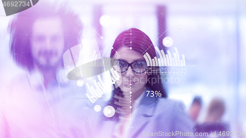 Image of young Business People Working With Tablet in startup office