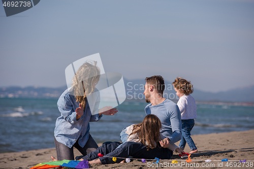 Image of happy family enjoying vecation during autumn day