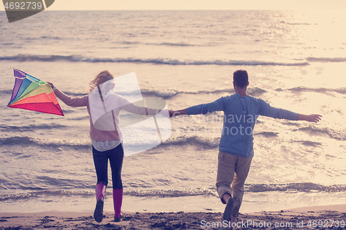 Image of Couple enjoying time together at beach