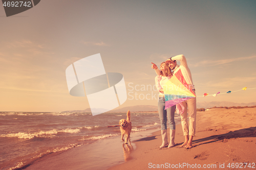 Image of happy couple enjoying time together at beach