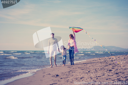 Image of happy family enjoying vecation during autumn day