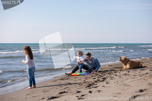 Image of happy young family enjoying vecation during autumn day