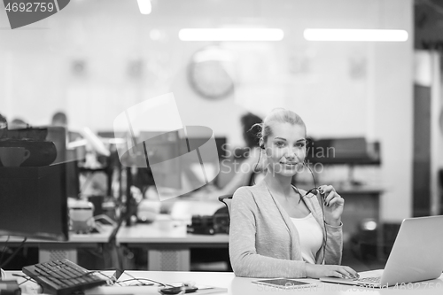 Image of businesswoman using a laptop in startup office