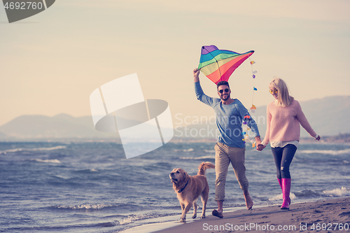 Image of happy couple enjoying time together at beach