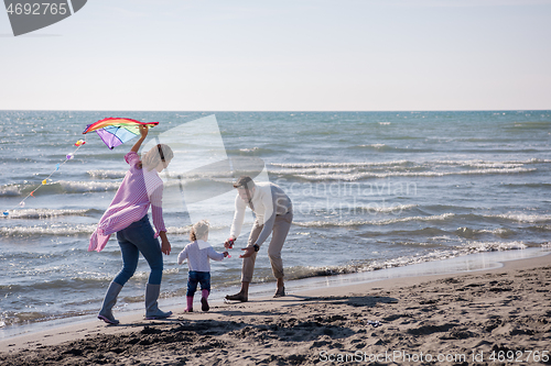 Image of happy family enjoying vecation during autumn day