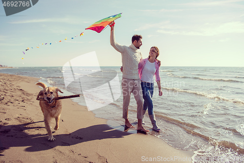 Image of happy couple enjoying time together at beach