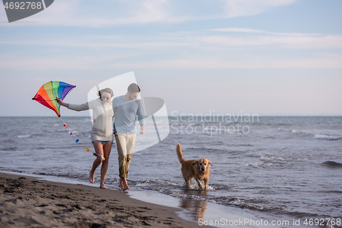 Image of happy couple enjoying time together at beach