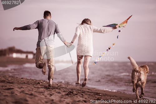 Image of happy couple enjoying time together at beach