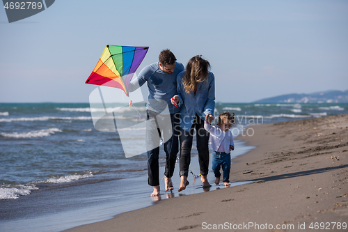 Image of happy family enjoying vecation during autumn day