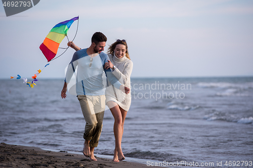 Image of Couple enjoying time together at beach